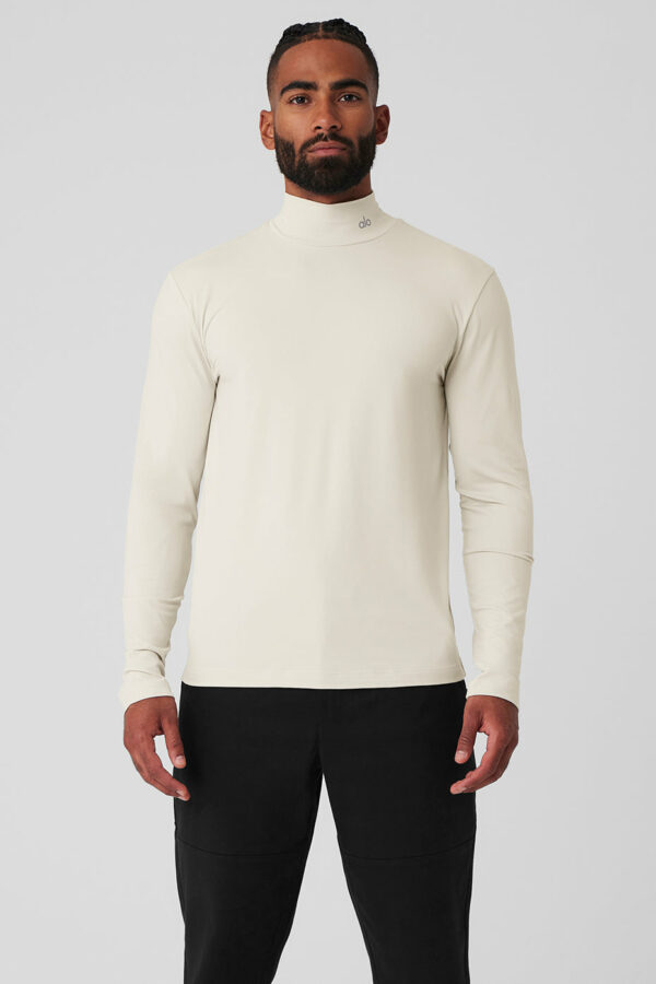 Alo Yoga | Conquer Reform Mock Neck Long Sleeve Top in Bone Beige